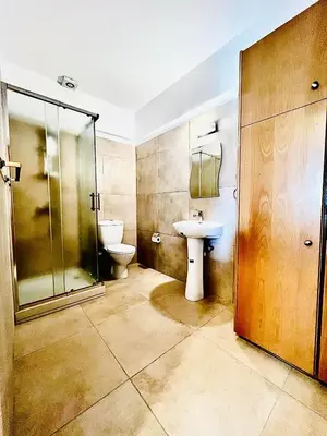 a bathroom with a toilet and a sink at Mackenzie 11 in Larnaka