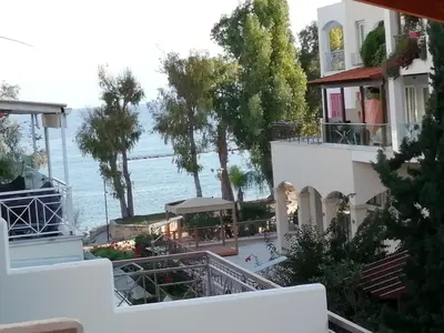 a view of the ocean from the balcony of a house at GALATEX BEACH STUDIO in Limassol