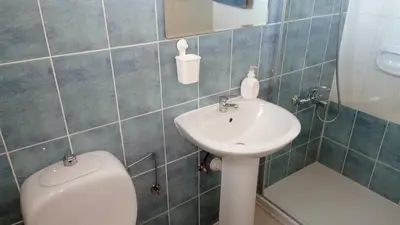 a bathroom with a toilet and a sink at GALATEX BEACH STUDIO in Limassol