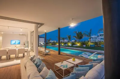 a living room with a view of a pool at Olivine Pearl OL3 in Protaras