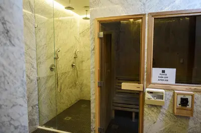 a bathroom with a shower and a glass door at 360 Nicosia Heights, Gym & Pool in Nicosia