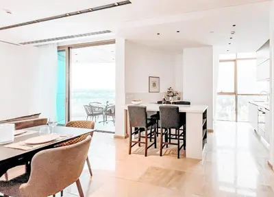 a kitchen and dining room with white walls and floor to ceiling windows at 360 Nicosia Heights, Gym & Pool in Nicosia