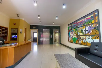 a hospital lobby with a large painting on the wall at Flat in Nicosia's centre in Nicosia
