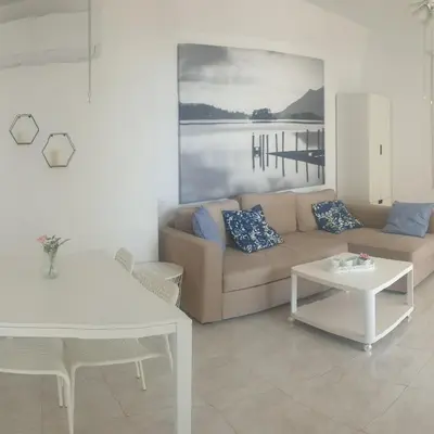 a living room with a couch and a table at Sea Heart Villa Beachfront in Pyla