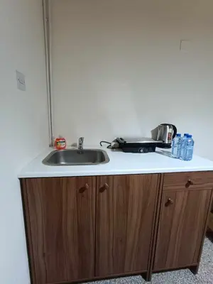 a sink in a kitchen with a counter top at Galata's Bridge Hotel in Galata