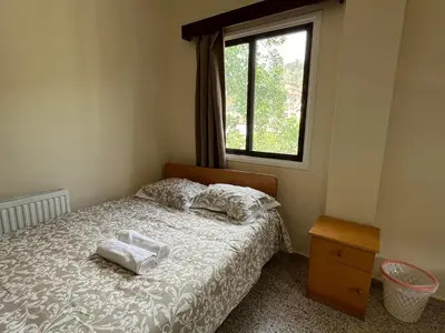 a bedroom with a bed with two towels on it at Galata's Bridge Hotel in Galata