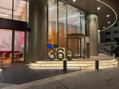 a building with a sign on the front of it at SkyHigh Central 360 Gym & Pool in Nicosia