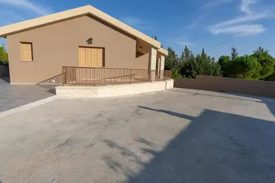 a house with a large driveway in front of it at Eidyllio ''The Mansion'' in Omodos