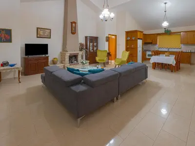 a large living room with a couch and a table at Eidyllio ''The Mansion'' in Omodos