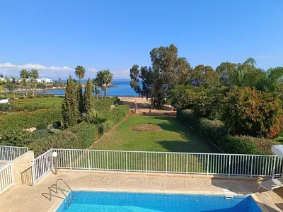 a swimming pool with a view of the ocean at Horizon Villa Protaras in Protaras