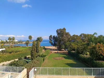 a view of the ocean from the balcony of a house at Horizon Villa Protaras in Protaras