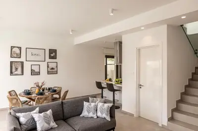 a living room with a couch and a table at Protaras By the Bay Villa 32 in Protaras