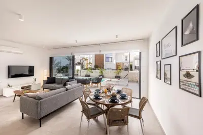 a living room with a couch and a table at Protaras By the Bay Villa 32 in Protaras