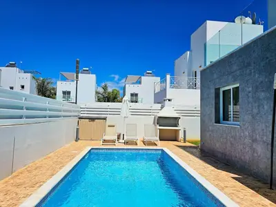 a swimming pool in the backyard of a house at Nissi beach villa Holiday in Ayia Napa