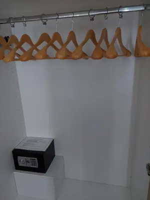 a shelf with shoes and a scale in a room at Milepost vacations in Paralimni