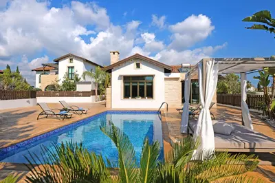 a swimming pool in front of a house at Villa Lara - 3bed Bangalow with Large Pool in Ayia Napa