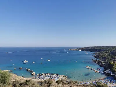 a view of a beach with boats in the water at Beach bliss apartment in Protaras