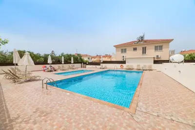 a swimming pool in a villa with a house at Estelle Suite in Ayia Napa