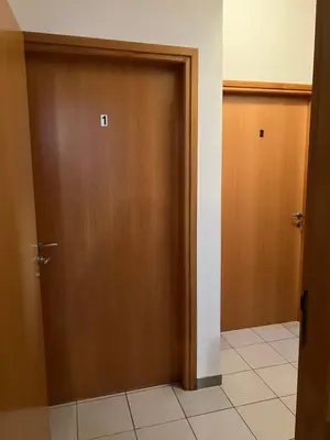 an open door in a room with a door at Makenzie 2 rooms first line beach in Larnaka