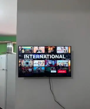 a flat screen tv hanging on a wall at Lovely studio in Makedonitissa in Nicosia