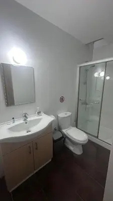 a bathroom with a toilet and a sink and a shower at Lovely studio in Makedonitissa in Nicosia