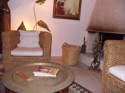 a living room with a coffee table and a fireplace at Historical House in the Old City of Nicosia in Nicosia