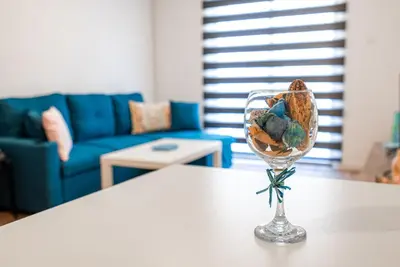 a glass vase with rocks in it sitting on a table at COZY Apartment In Kapparis #2 in Paralimni