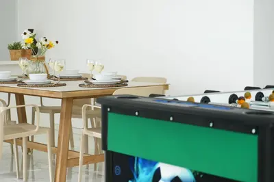 a table with a television in a dining room at Villa Napa Blu in Ayia Napa