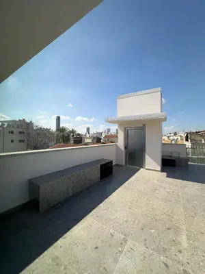 a building with a bench on the roof at MARTIN Nicosia City Suites in Nicosia