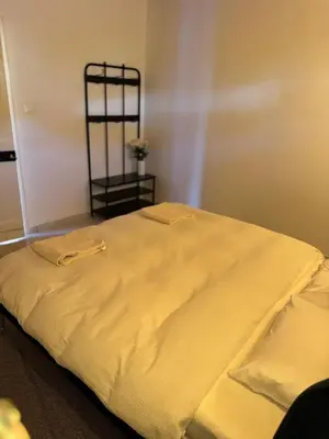 a large white bed sitting in a room at Pirella House in Limassol