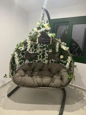 a chair with flowers on it in a room at Pirella House in Limassol