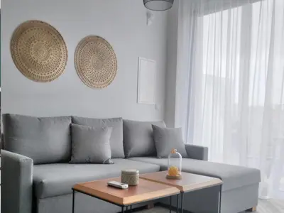 a living room with a couch and a coffee table at Mythical Sands - Orion in Protaras