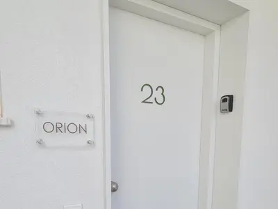 an open door with an option sign on it at Mythical Sands - Orion in Protaras