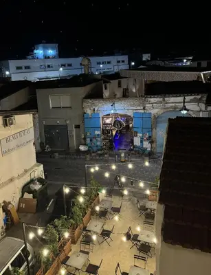 an overhead view of a patio at night with lights at Spacious 1 bedroom flat in Foinikoudes! in Larnaka