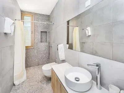 a white bathroom with a sink and a toilet at Azure Seaview - Garnet Villa in Protaras