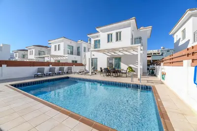 a swimming pool in the backyard of a house at Sunrise Bay Villa #3 in Protaras