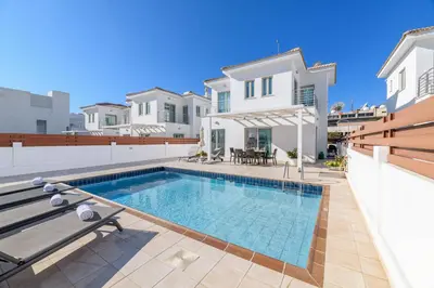 a swimming pool in the backyard of a house at Sunrise Bay Villa #4 in Protaras