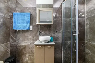 a bathroom with a sink and a shower at Mylos Lifestyle Seaview Villa #15 in Protaras