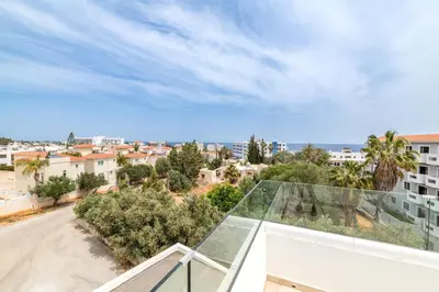 a glass roof on a building with a view of a street at Green Bay Villa #14 in Protaras