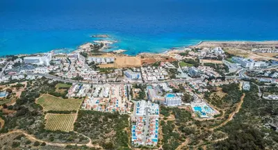an aerial view of a resort next to the ocean at Green Bay Villa #14 in Protaras