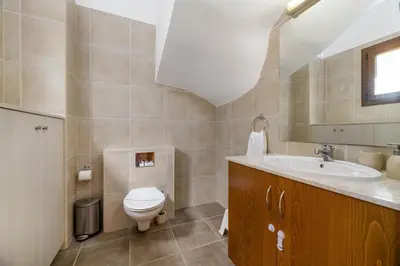 a bathroom with a toilet and a sink at Villa Greco Mare #40 in Protaras
