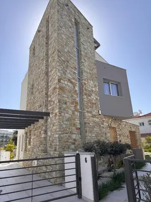 a building with a brick wall and a building at City Napa Seaview Villas - Villa 6 in Ayia Napa