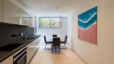 a kitchen with a table and chairs in a room at City Napa Seaview Villas - Villa 6 in Ayia Napa