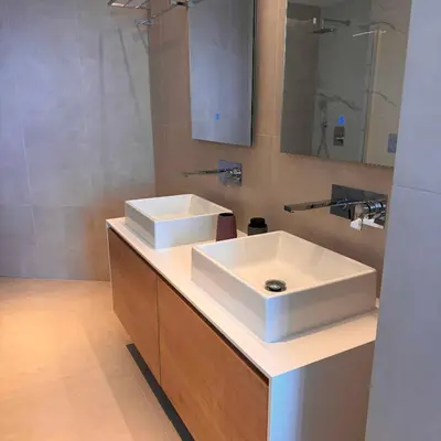 a bathroom with a white sink and a mirror at Ayia Napa Marina Exclusive Apartment in Ayia Napa