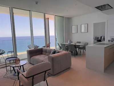a living room with a couch and a table at Ayia Napa Marina Exclusive Apartment in Ayia Napa
