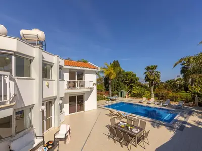 a large white house with a swimming pool at Villa Alexandra in Protaras