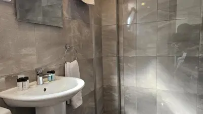a bathroom with a sink and a shower at STAY Blissful Apartment in Protaras