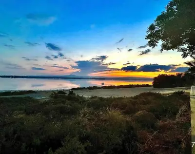 a sunset over a body of water with the sky at KAMILA 5 in Voroklini