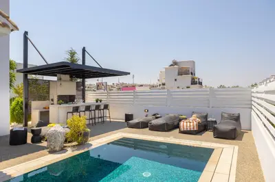a rooftop patio with a swimming pool and a bar at SunnyVillas-3BR New Modern Villa-Private Pool-HVN in Paralimni