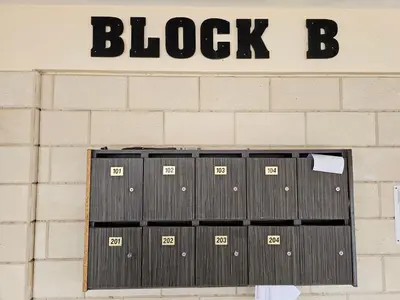 a bunch of black garage doors on a brick wall at STEFARIS sea & mountain view in Larnaka